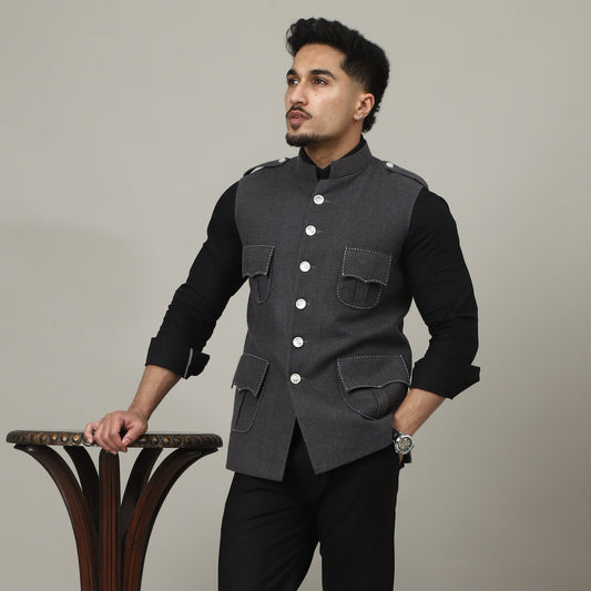 Person holding a decorative urn against a plain background