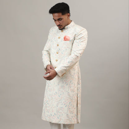 Person wearing a traditional outfit with a plain background