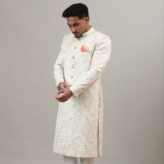 Person wearing a traditional outfit with a plain background