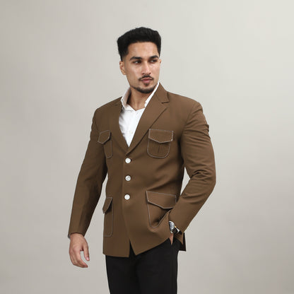 Man wearing a brown coat and black pants on a plain background